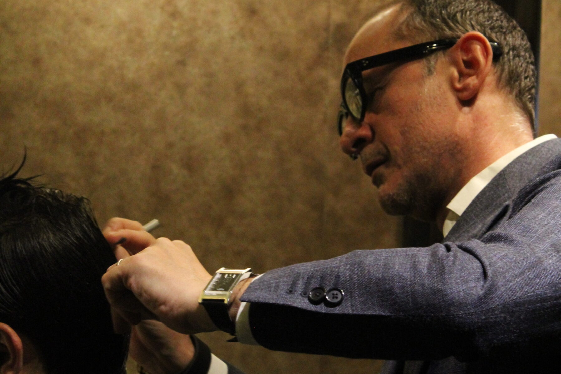 A Martial Vivot master stylist mid-cut at a New York styling station