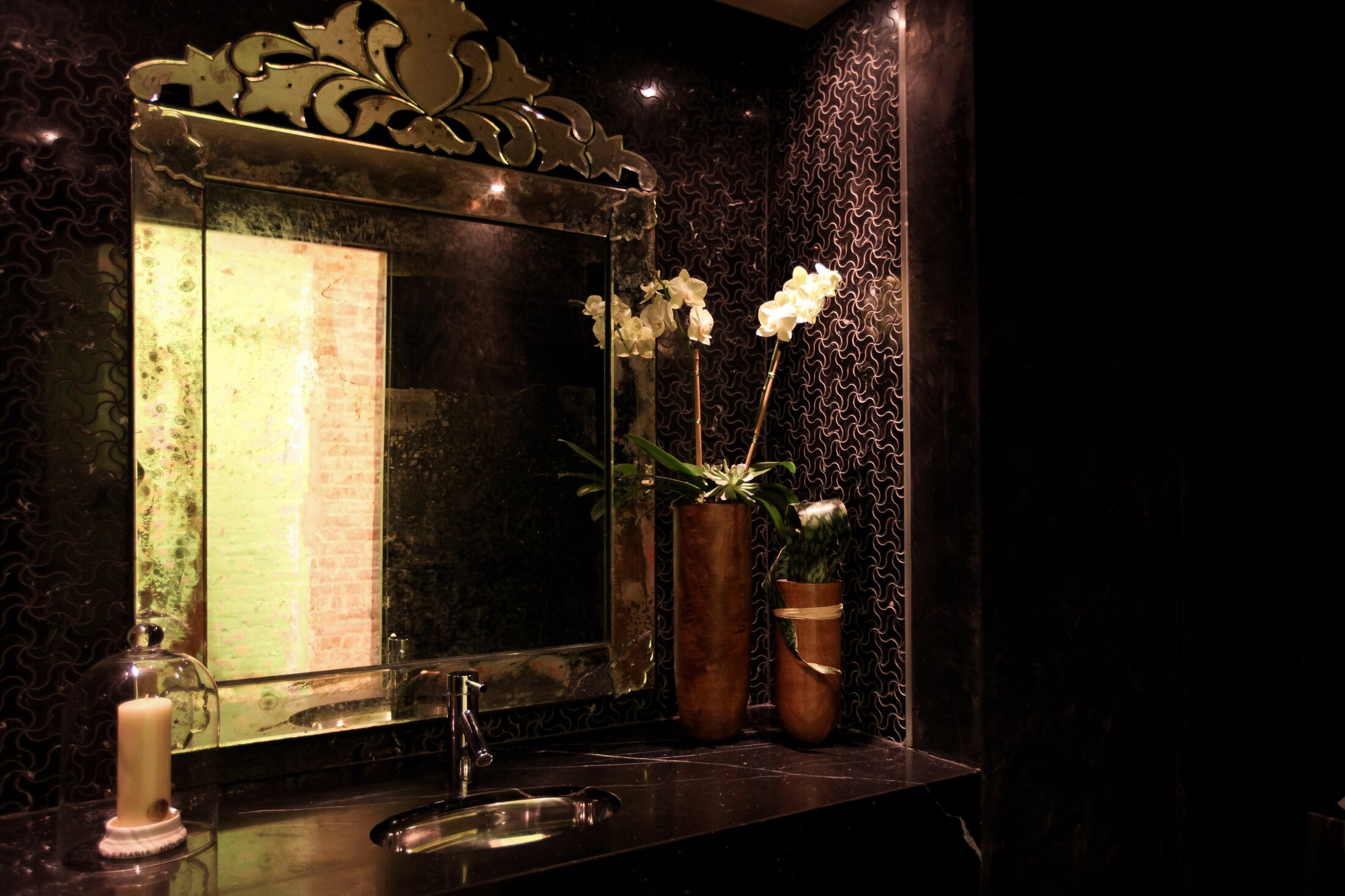 An ornate mirror and orchids in the Martial Vivot Midtown salon