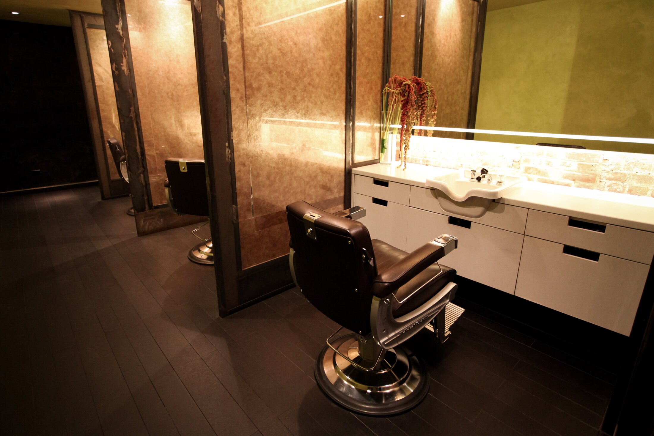 A styling station and mirror inside the Martial Vivot Midtown salon