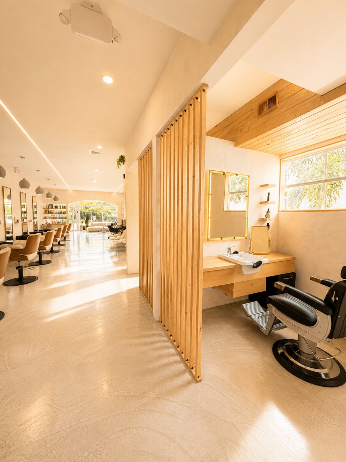 The men's barber section inside the Red Market × Martial Vivot salon in West Palm Beach